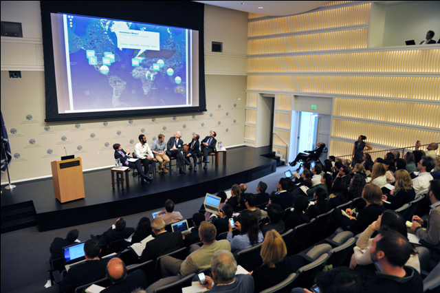 Panelists looking at map. (USIP-Fitz)
